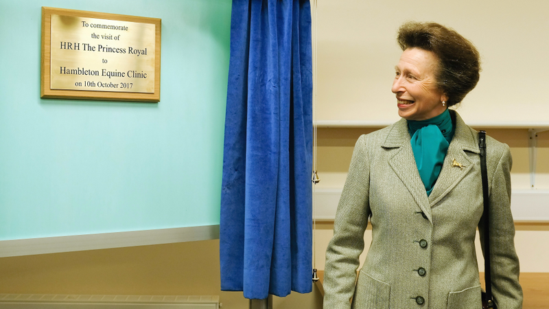 Princess Anne appreciating a plaque.